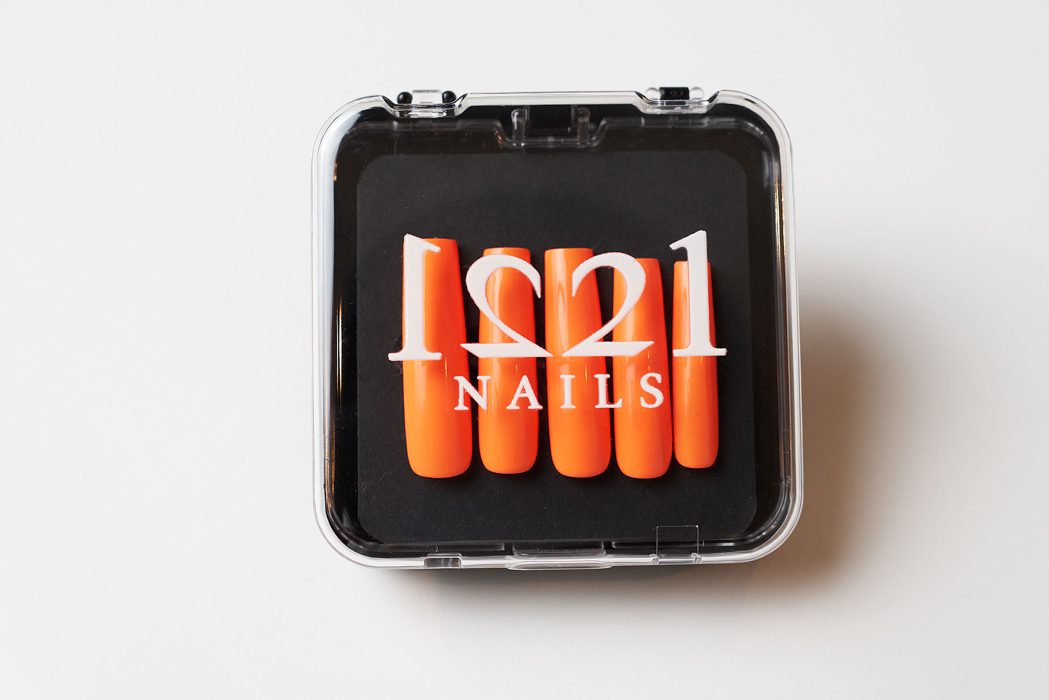 Orange nails in their case