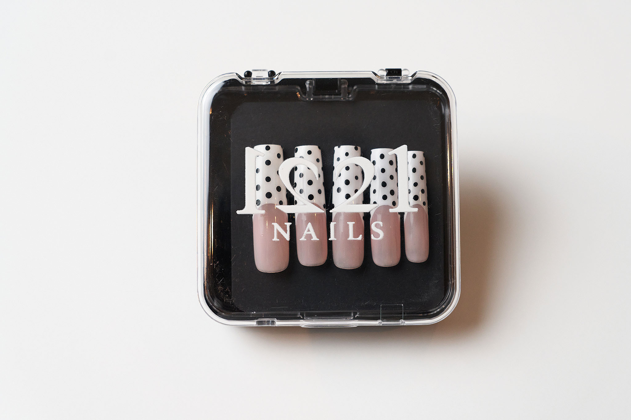 Polka Dot Frenchies nails in their case